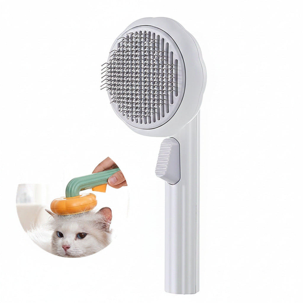 Boutique Pumpkin Self-Cleaning Brush - Aesthetic Grooming & Deshedding Comb showing a sleek white handheld brush with fine metal bristles and a self-cleaning button, designed for easy pet grooming.
