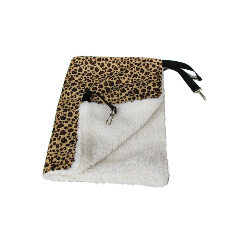 Thermal Hanging Cat Hammock - Double-Sided Winter Warm Fleece Bed for Cages, Crates & Chairs featuring leopard print outer fabric and soft white fleece interior with metal hooks for easy hanging.