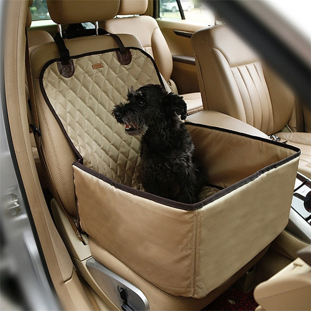 Black dog sitting in a beige Heavy-Duty Dog Car Booster Seat - Waterproof & Nonslip Safety Basket for Front or Back Seat installed on a car front passenger seat.