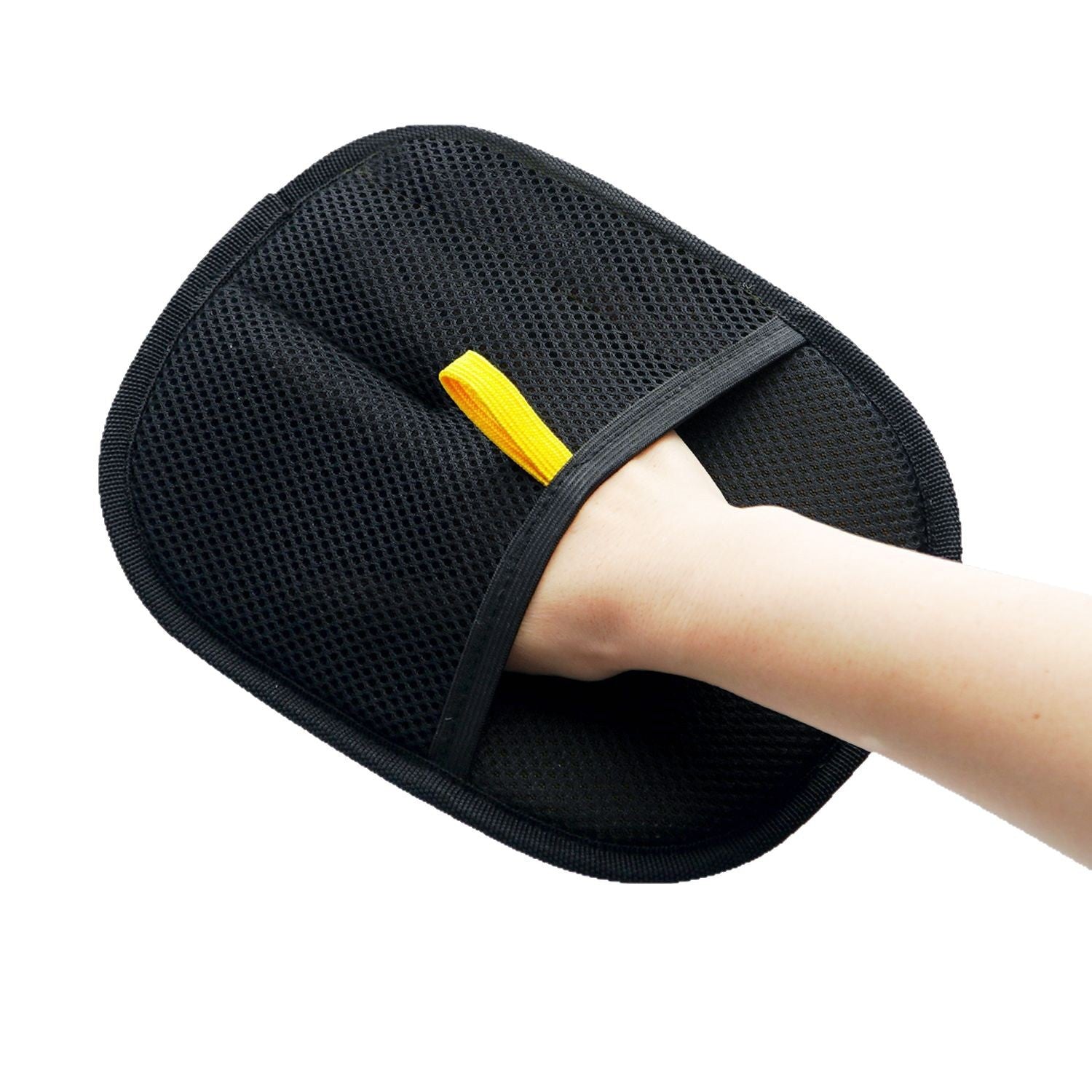 Hand wearing the Electrostatic Pet Hair Removal Glove - Bidirectional Grooming & Fabric Cleaner in black mesh fabric with a yellow pull tab, designed for easy pet grooming and fabric cleaning.