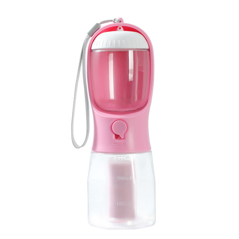 Compact pink and white 3-in-1 Pet Travel Station – Integrated Water, Food & Waste Management bottle with wrist strap designed for convenient, high-performance pet care on the go.
