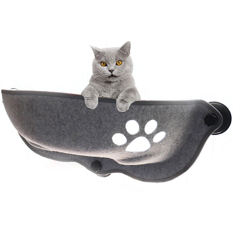 Gray cat resting in a glass-mounted luxury felt cat window pod featuring a paw print design, offering a stylish sun lounger and private hideaway for pets.