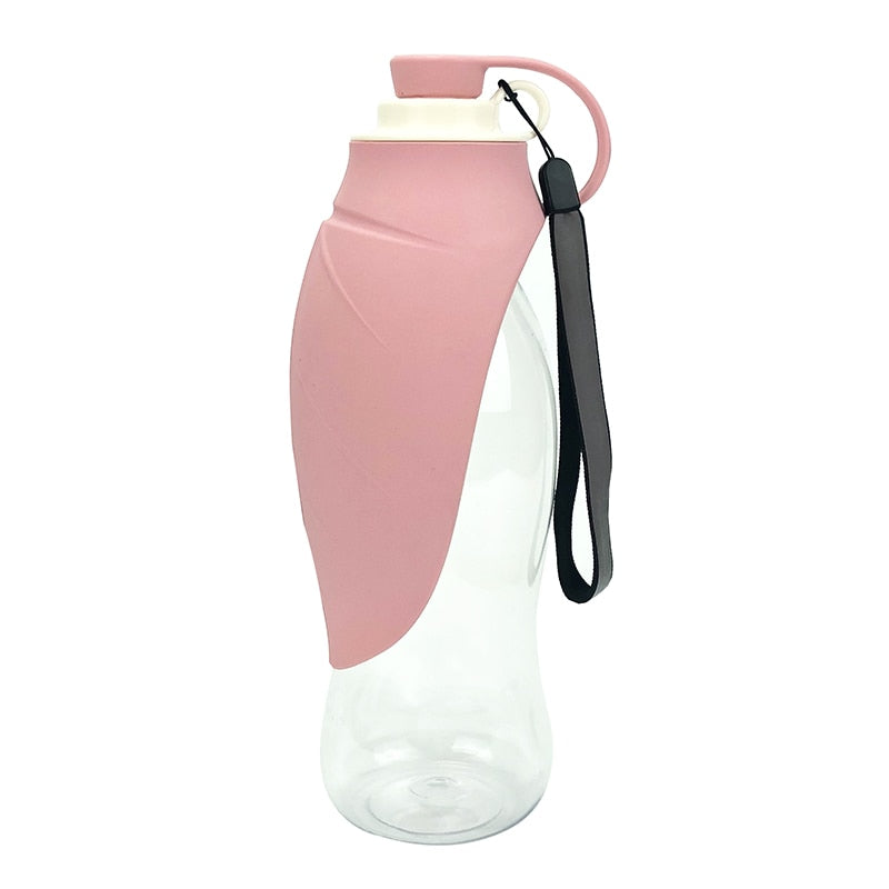 Large Silicone Leaf Bottle - 580ml Portable Travel Bottle in soft pink silicone sleeve with clear body and black carrying strap, ideal for travel and everyday hydration.