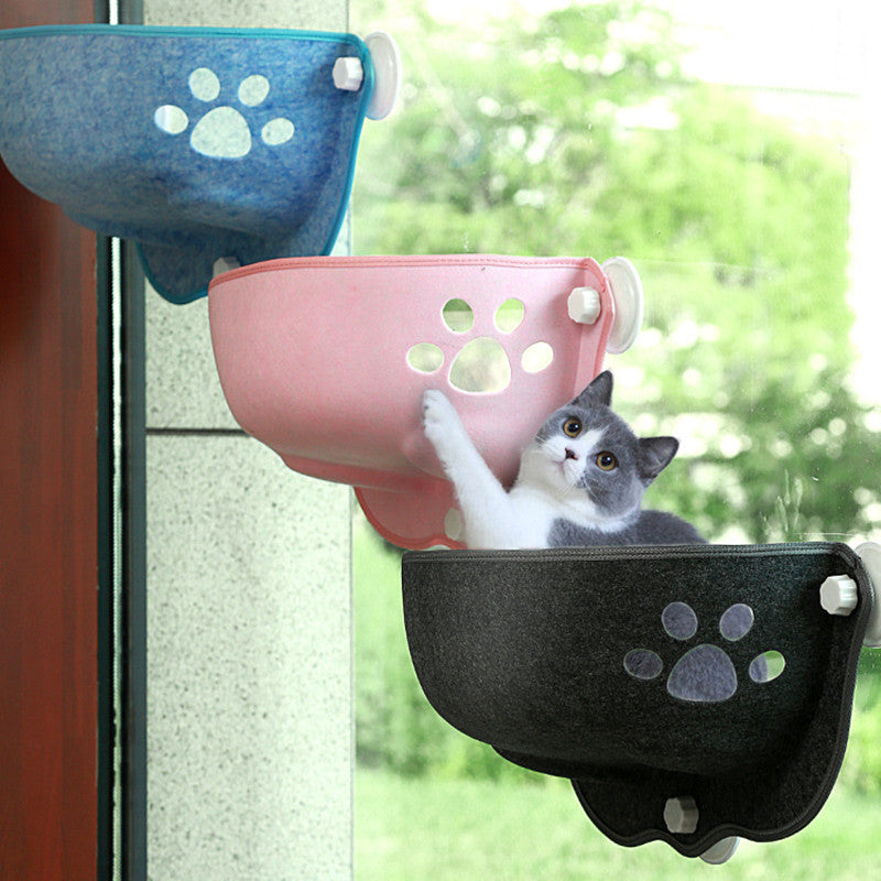 Luxury Felt Cat Window Pod - Designer Glass-Mounted Sun Lounger & Private Hideaway in blue, pink, and black, attached to a window with a relaxed cat lounging in the pink pod.