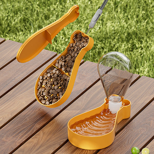 Yellow 2-Layer Pet Travel Station – Dual-Chamber Portable Feeder with separate compartments for food and water, designed for easy outdoor pet feeding on a wooden surface.