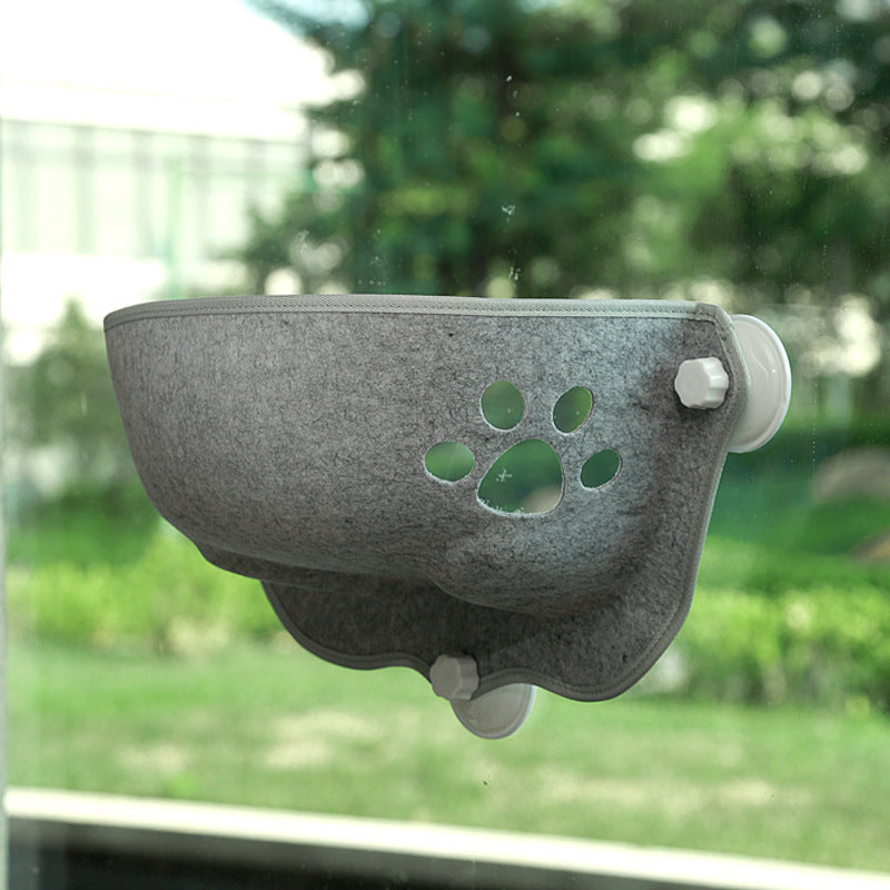 Luxury Felt Cat Window Pod - Designer Glass-Mounted Sun Lounger & Private Hideaway in gray felt featuring a decorative paw cutout, attached securely to a window with suction cups.