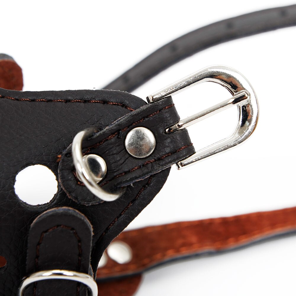 Close-up of a metal buckle and leather strap detail on the Professional Adjustable Basket Muzzle - Breathable Anti-Bite Security Shield showing durable stitching and secure fastening components.