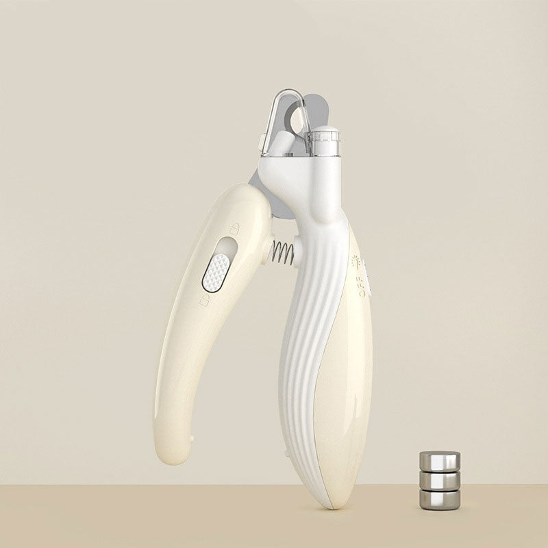 LED Illuminated Dog Nail Clippers - Professional Grooming Trimmer with Safety Guard in a sleek cream color, shown alongside small metal weights on a neutral background.