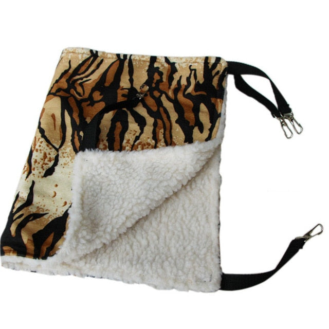 Thermal Hanging Cat Hammock - Double-Sided Winter Warm Fleece Bed for Cages, Crates & Chairs with tiger print exterior and soft white fleece interior, including adjustable straps and metal clips for secure hanging.