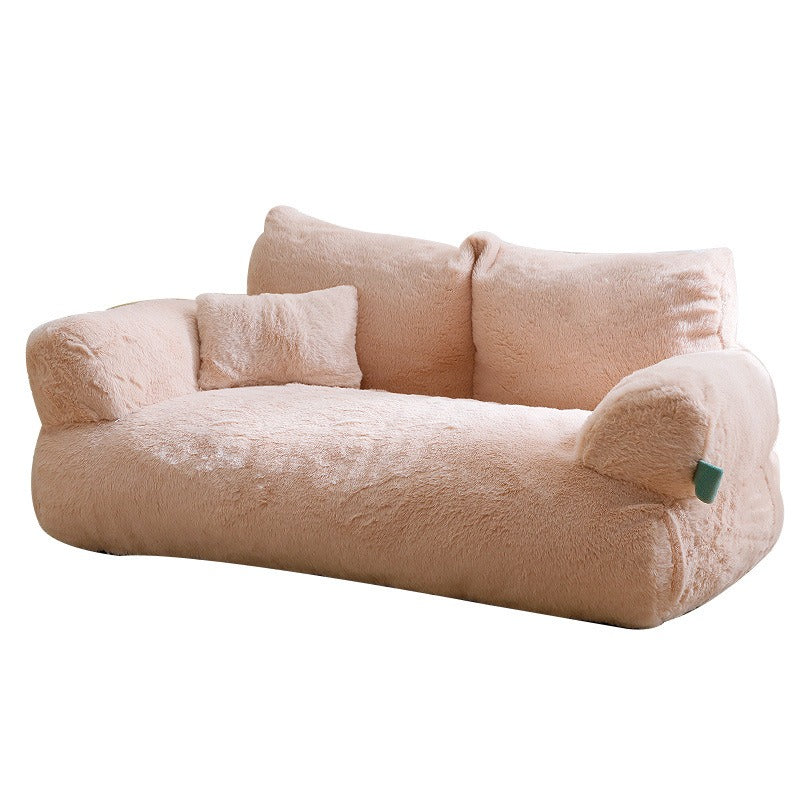 Orthopedic Calming Pet Sofa - Luxury Plush Dog & Cat Bed Couch with Bolster Support in soft beige, featuring cushioned armrests and supportive backrest for ergonomic comfort.