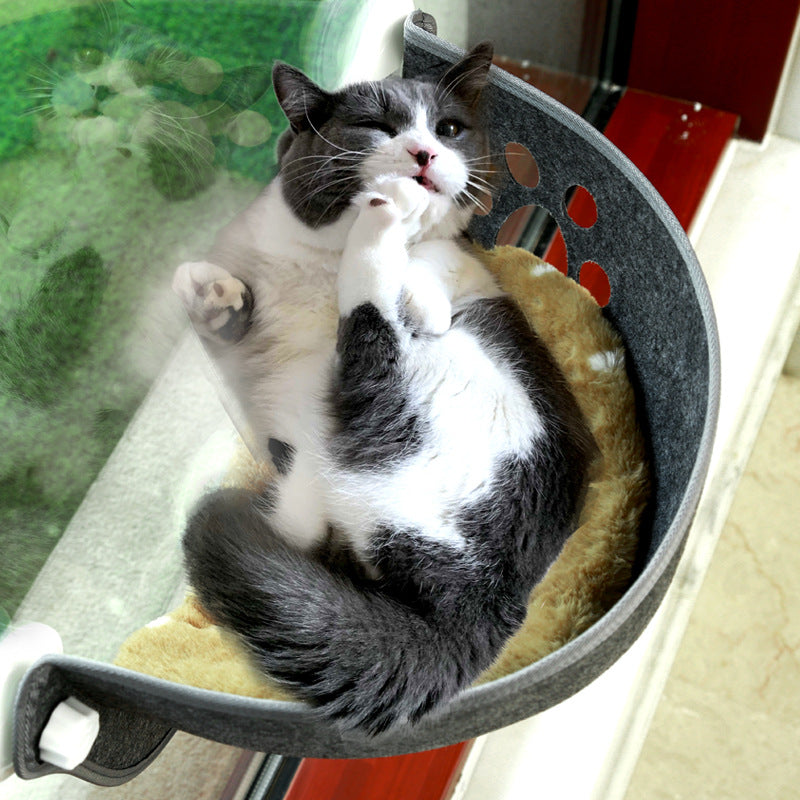 Gray and white cat lounging comfortably in a Luxury Felt Cat Window Pod - Designer Glass-Mounted Sun Lounger & Private Hideaway, enjoying a cozy sunny spot by the window.