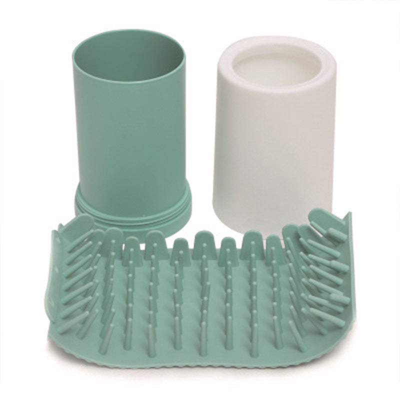 Portable Dog Foot Washer - Professional Muddy Paw Cleaning Cup disassembled showing soft silicone bristles and two plastic cup parts in muted green and white colors.