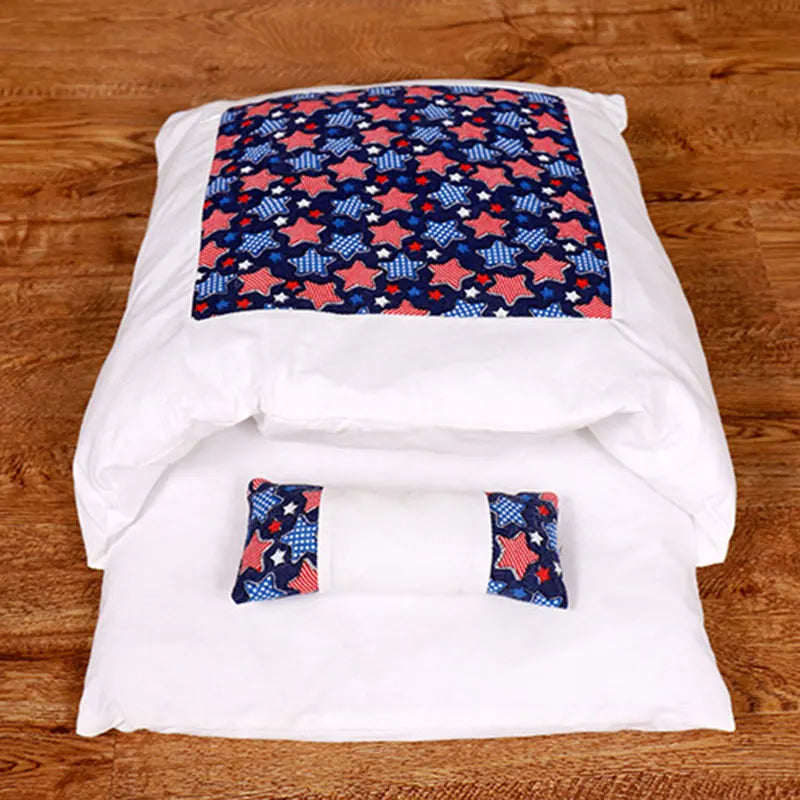 Deep-Sleep Cat Sleeping Bag - Self-Warming Burrower Bed & Thermal Hideaway with white exterior and navy blue patch patterned with red and white stars, cozy on wooden floor.