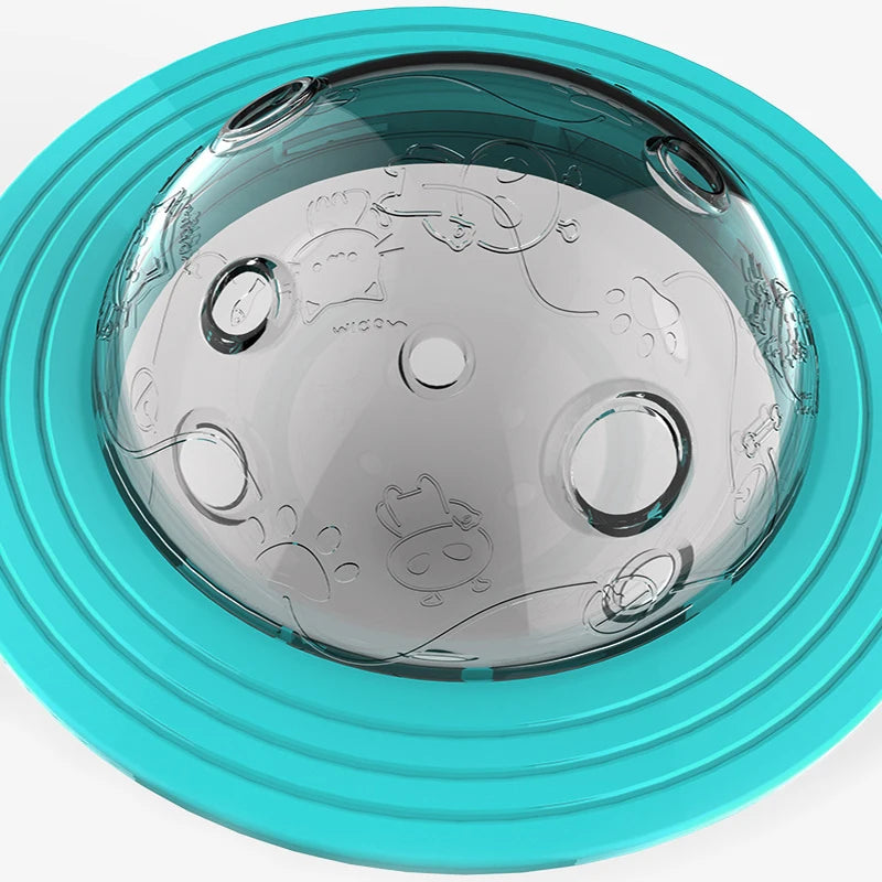 Interactive Flying Saucer Puzzle Feeder - IQ Training & Slow Feed Toy with a transparent dome featuring embossed animal designs and a bright blue base for engaging pet feeding.