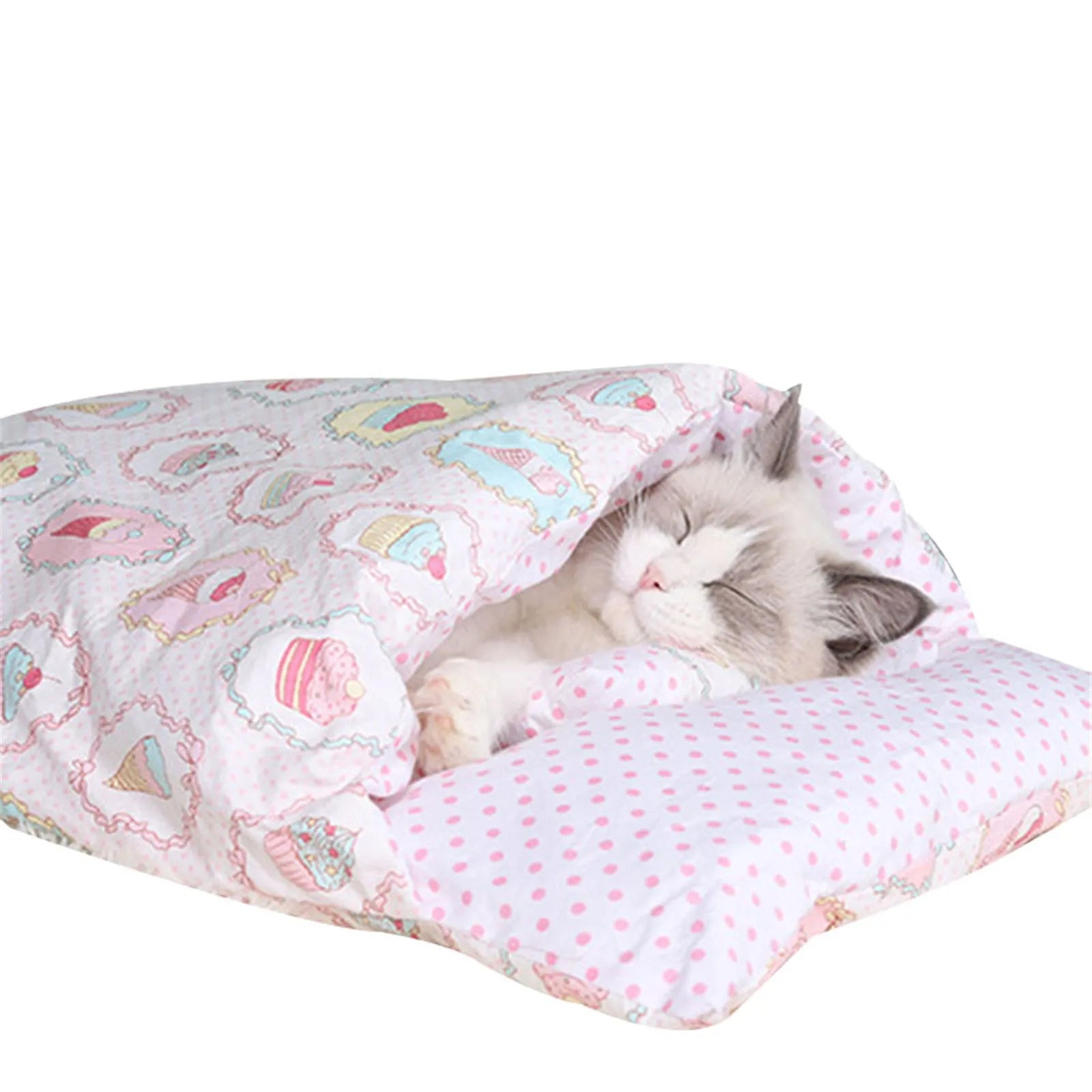 A contented cat sleeping peacefully inside the Deep-Sleep Cat Sleeping Bag - Self-Warming Burrower Bed & Thermal Hideaway, featuring soft pink polka dots and pastel patterned fabric.