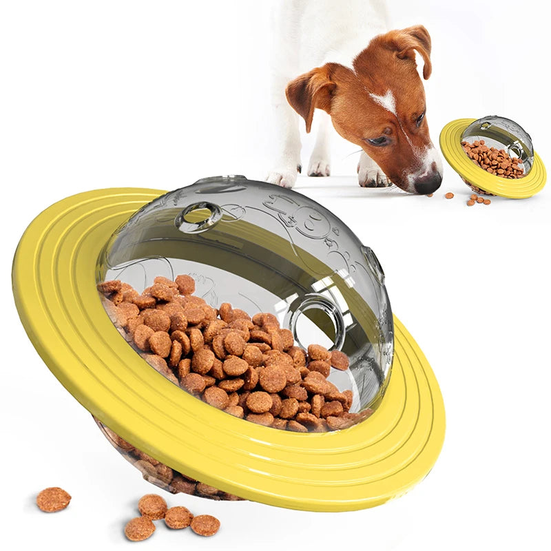 A small dog interacting with the Interactive Flying Saucer Puzzle Feeder - IQ Training & Slow Feed Toy filled with kibble, designed to slow eating and stimulate pet intelligence.