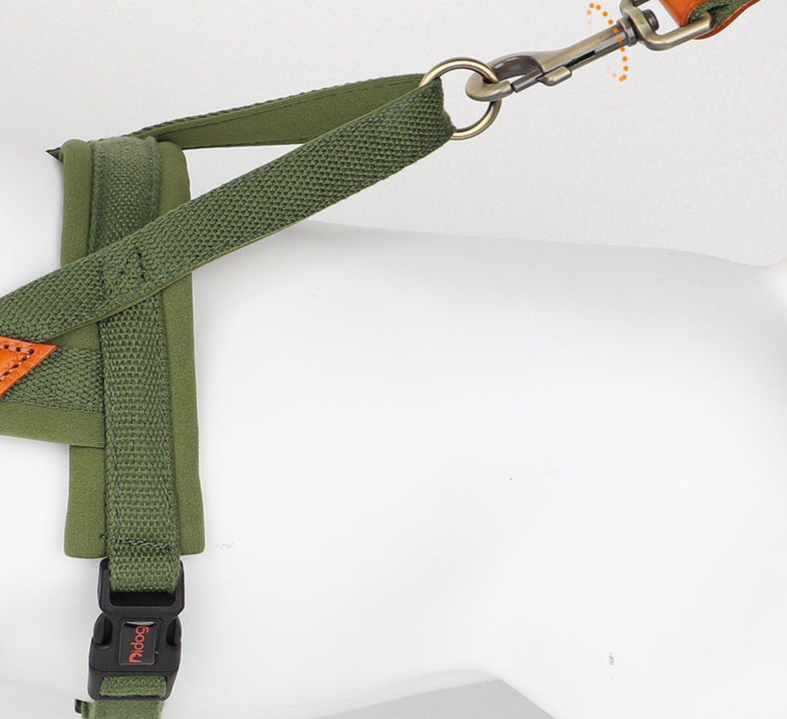 Close-up view of an olive green Ergonomic Soft-Padded No-Pull Harness - Reflective Anti-Slip Training Vest with sturdy strap and metal leash clip attached, designed for comfortable and secure dog walking.